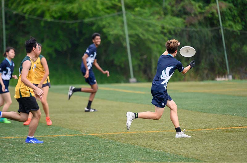 Students playing at friendly Ultimate Frisbee match